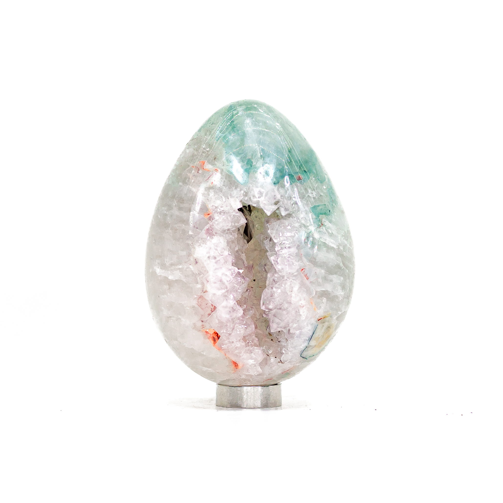 Cream-coloured calcite crystal points crowning a base of purple amethyst.